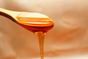 dripping honey from a spoon
